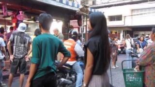 Stunningly Beautiful Thai Girl at the entrance to Soi Cowboy , Asok , Bangkok